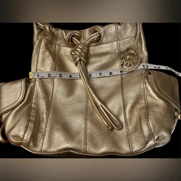 Michael Kors Metallic Gold Leather Drawstring Shoulder Bag. - Picture 8 of 16